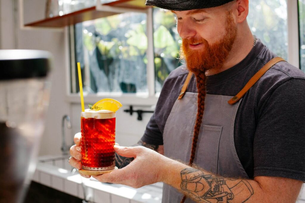 Man mixing drink at home